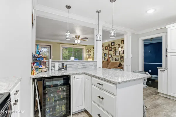 a kitchen with a sink stove and refrigerator