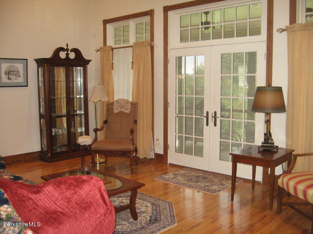 310 Dalton Division Road Pittsfield, MA 01201 - Photo 20 of 39 Living room access to porch