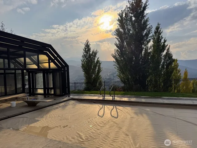 a view of a swimming pool with an outdoor space