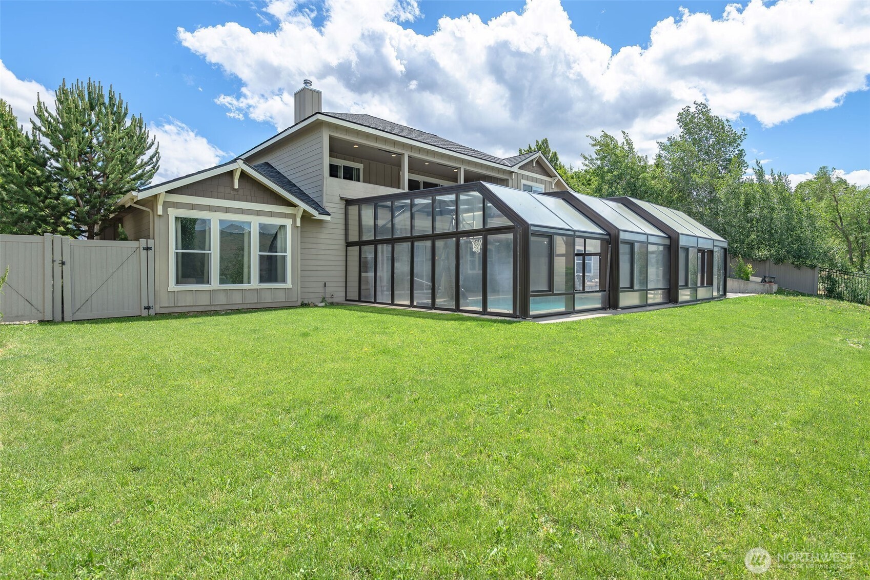 1400 Westpoint Place Wenatchee, WA 98801 - Photo 14 of 36 a view of a house with a big yard and large trees