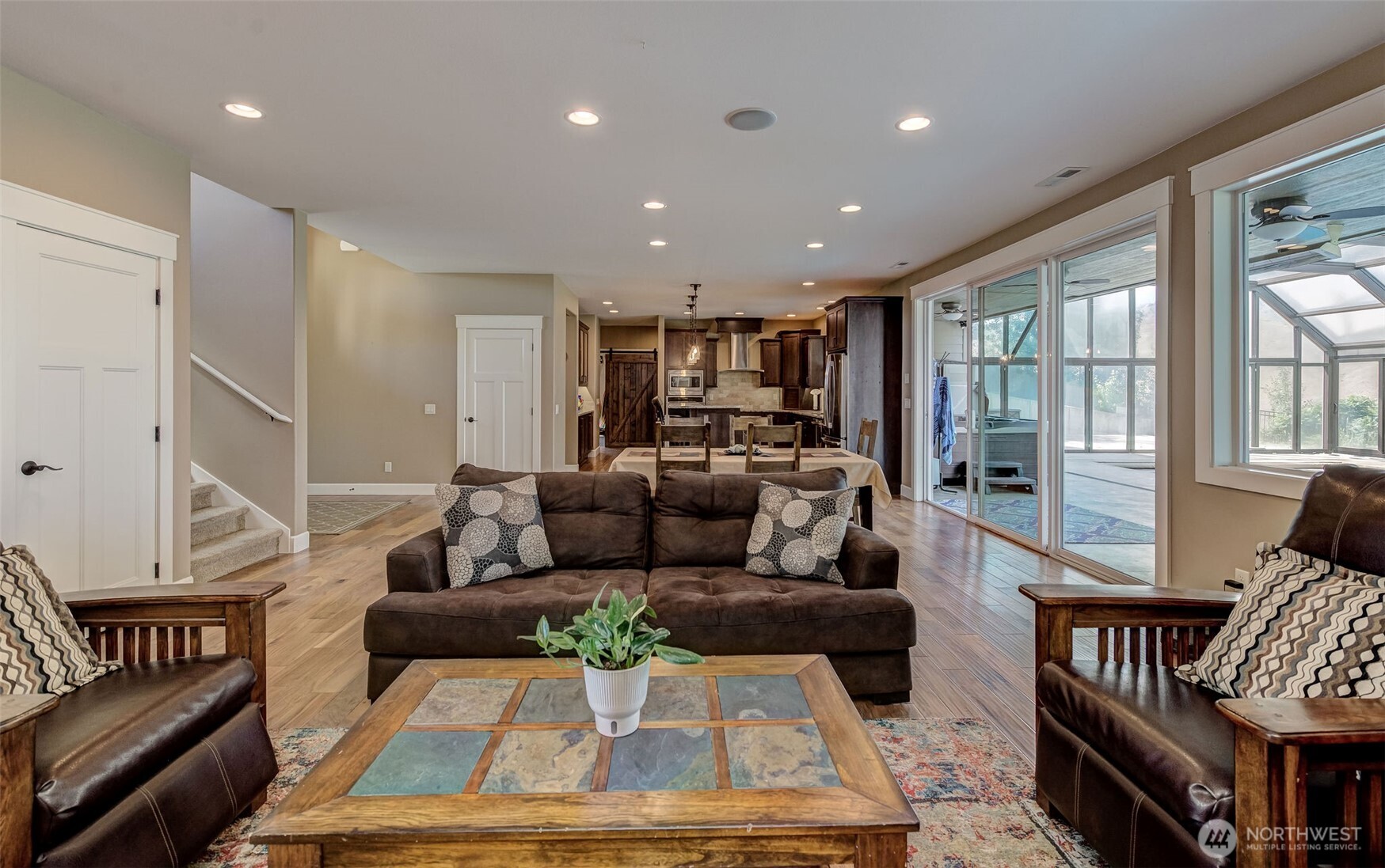 1400 Westpoint Place Wenatchee, WA 98801 - Photo 16 of 36 a living room with furniture and a dining table with wooden floor