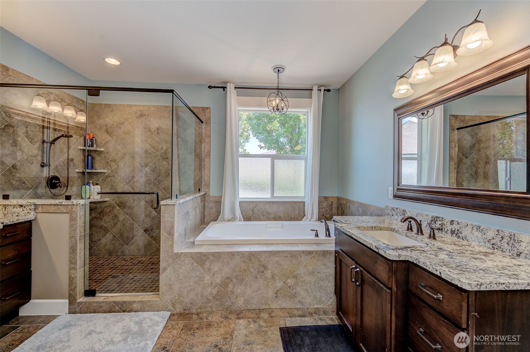 1400 Westpoint Place Wenatchee, WA 98801 - Photo 20 of 36 a bathroom with a double vanity sink and a mirror