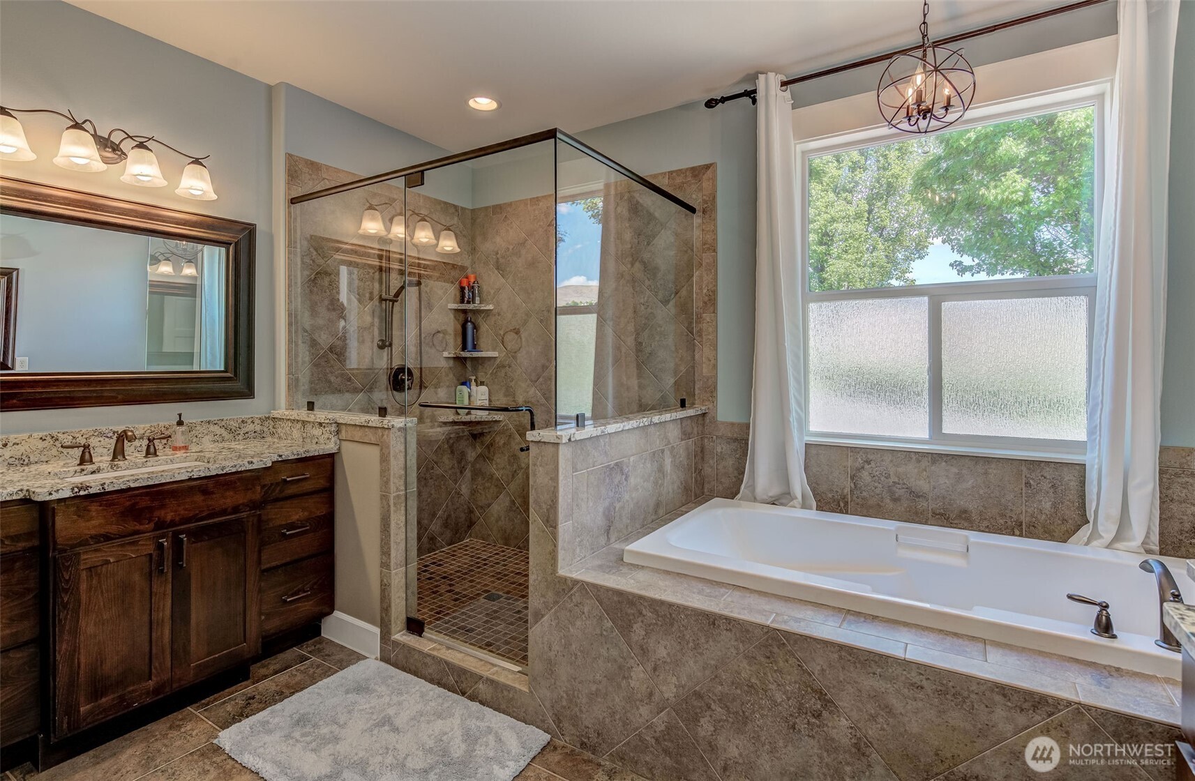 1400 Westpoint Place Wenatchee, WA 98801 - Photo 21 of 36 a bathroom with a tub sink and mirror