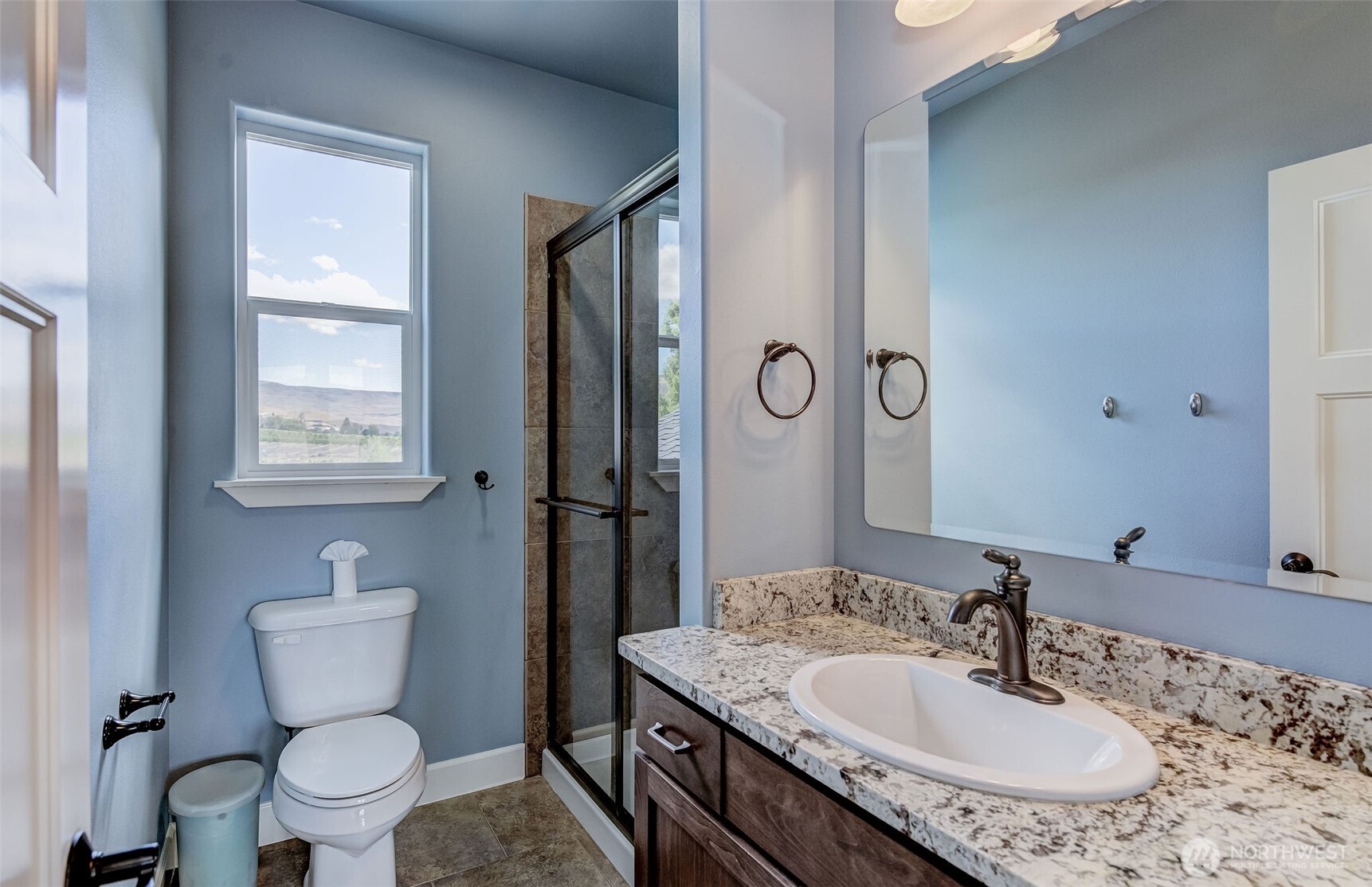 1400 Westpoint Place Wenatchee, WA 98801 - Photo 31 of 36 a bathroom with a granite countertop toilet sink and mirror