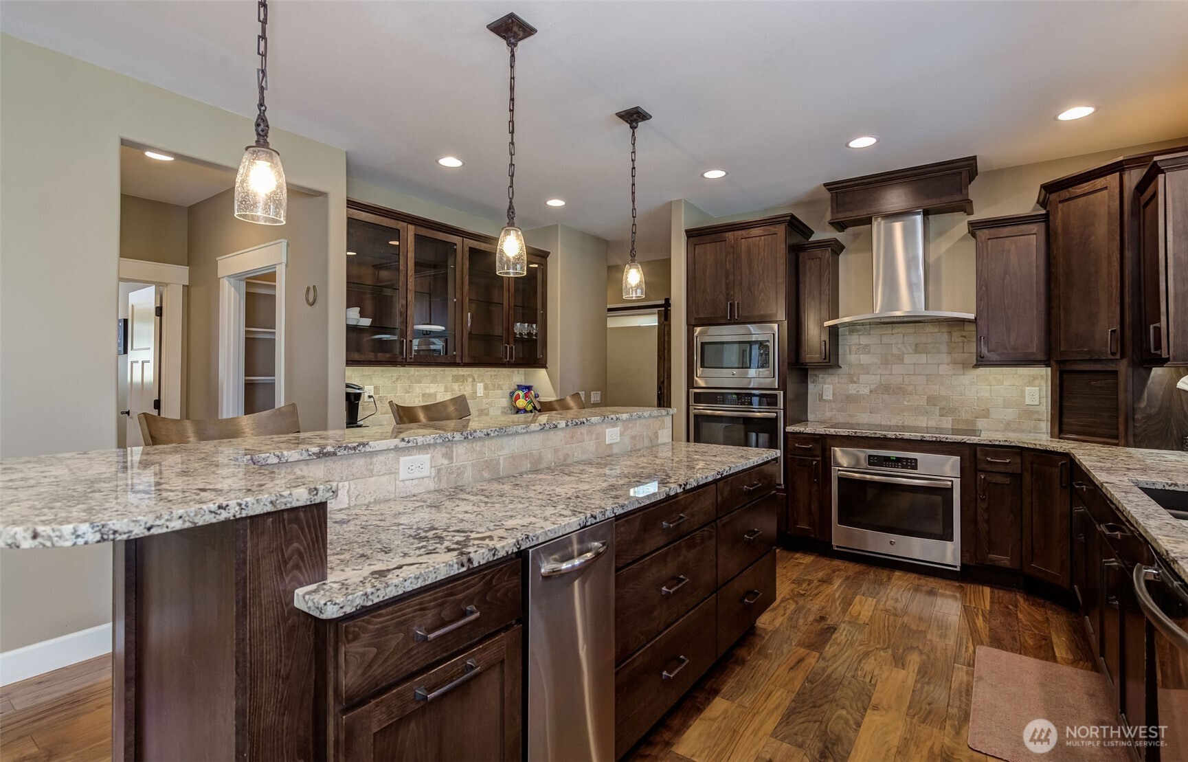 1400 Westpoint Place Wenatchee, WA 98801 - Photo 4 of 36 a kitchen with stainless steel appliances granite countertop a sink refrigerator and stove