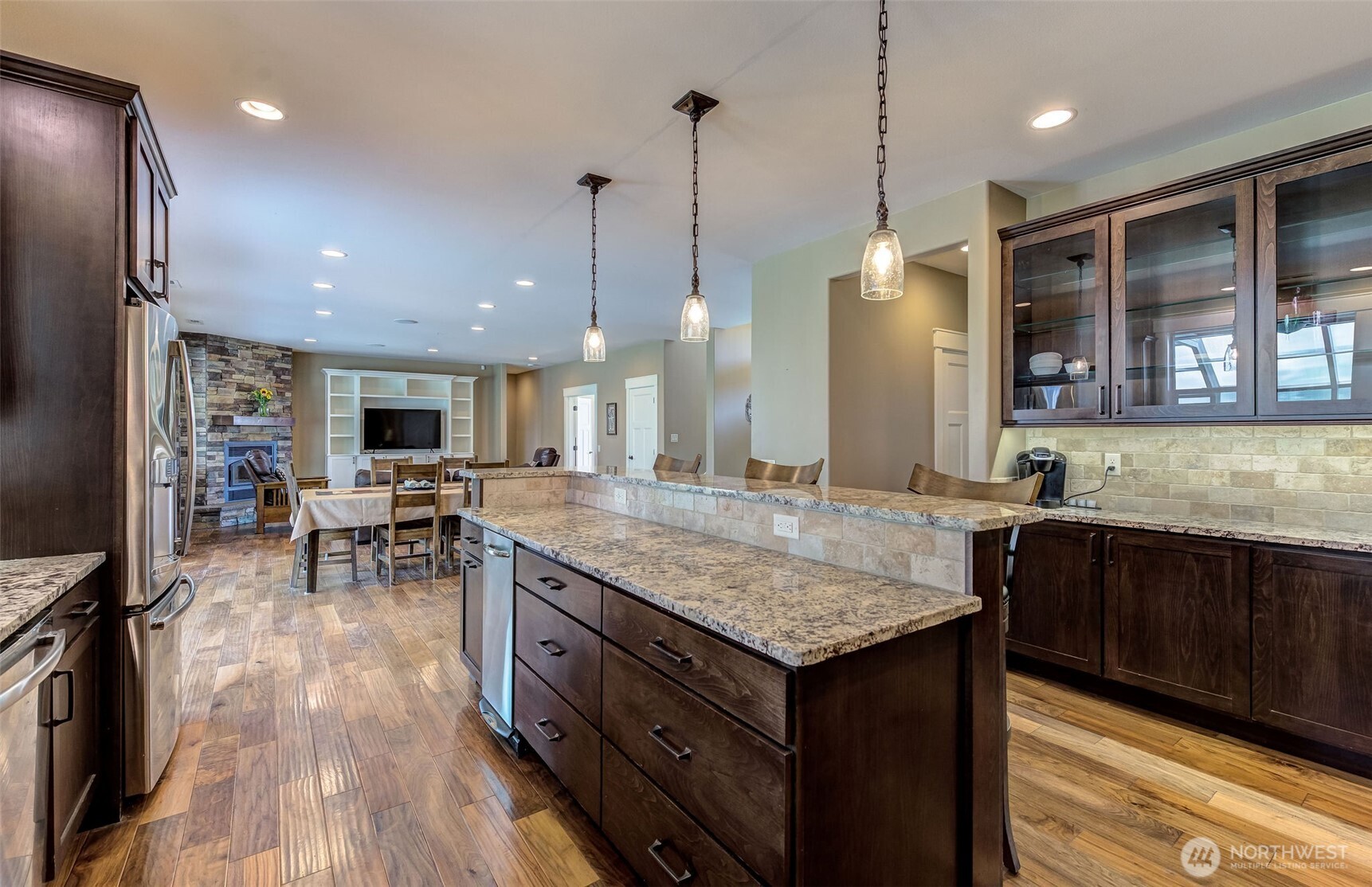 1400 Westpoint Place Wenatchee, WA 98801 - Photo 6 of 36 a kitchen with center island and stainless steel appliances
