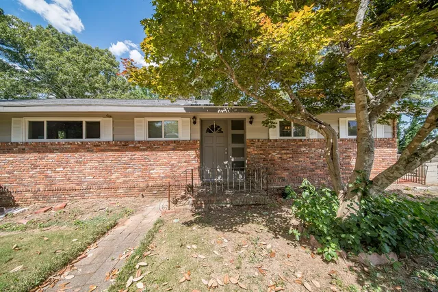 front view of a house with a yard