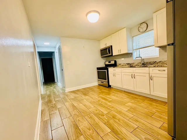 a view of a kitchen with a sink