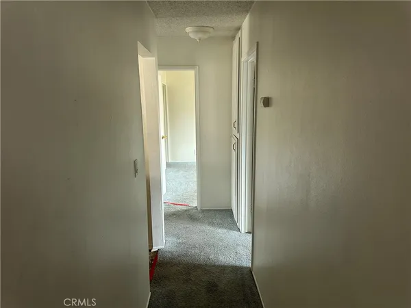 a view of a bathroom from a hallway