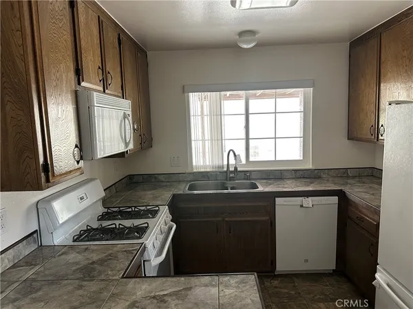 a kitchen with a stove and a sink