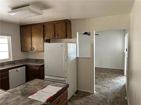 a kitchen with a refrigerator and a sink