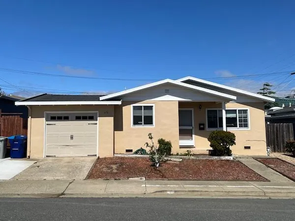 a front view of a house with yard