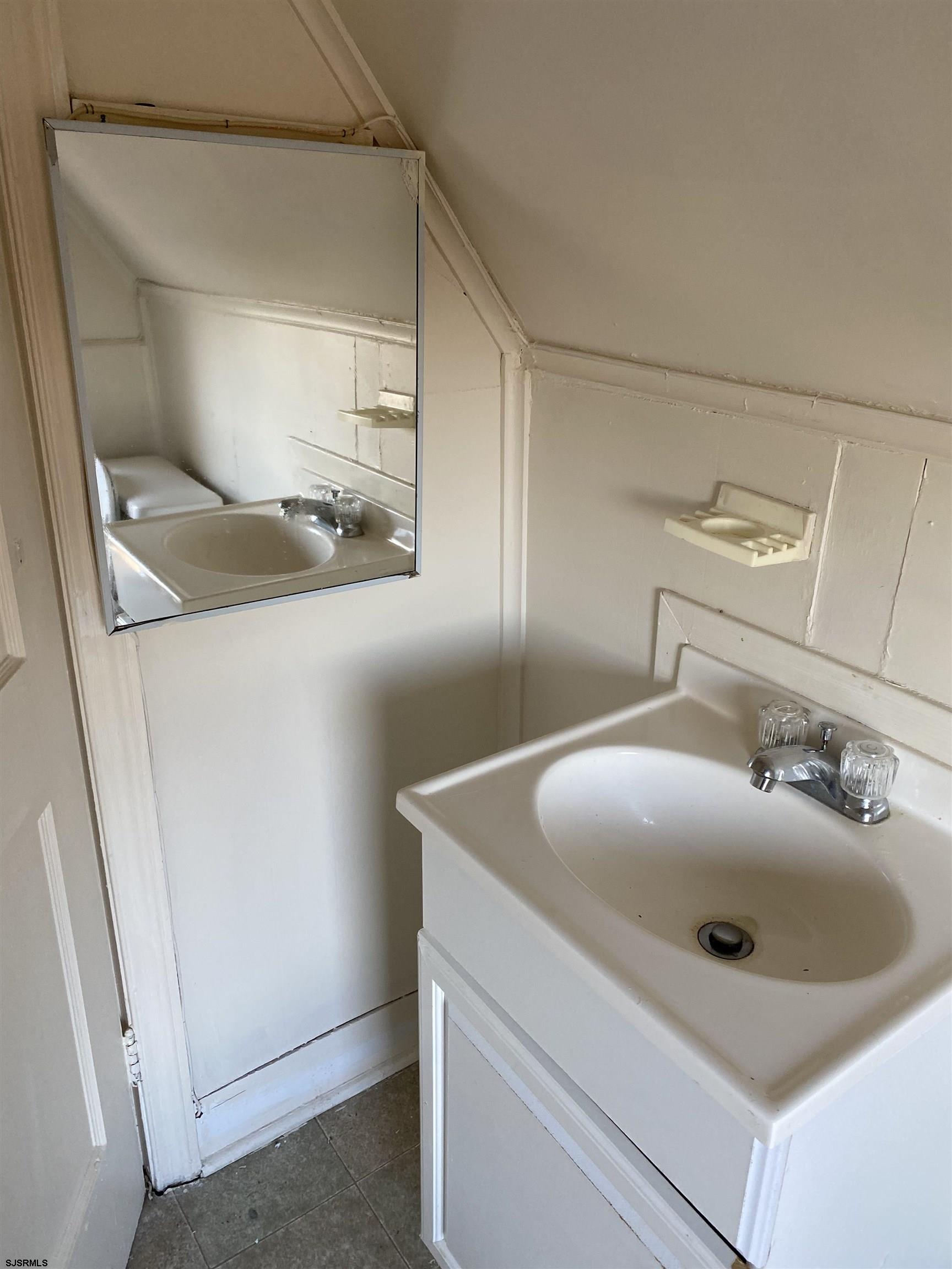 137 West Edgewater Avenue Pleasantville, NJ 08232 - Photo 29 of 36 a bathroom with a sink and vanity