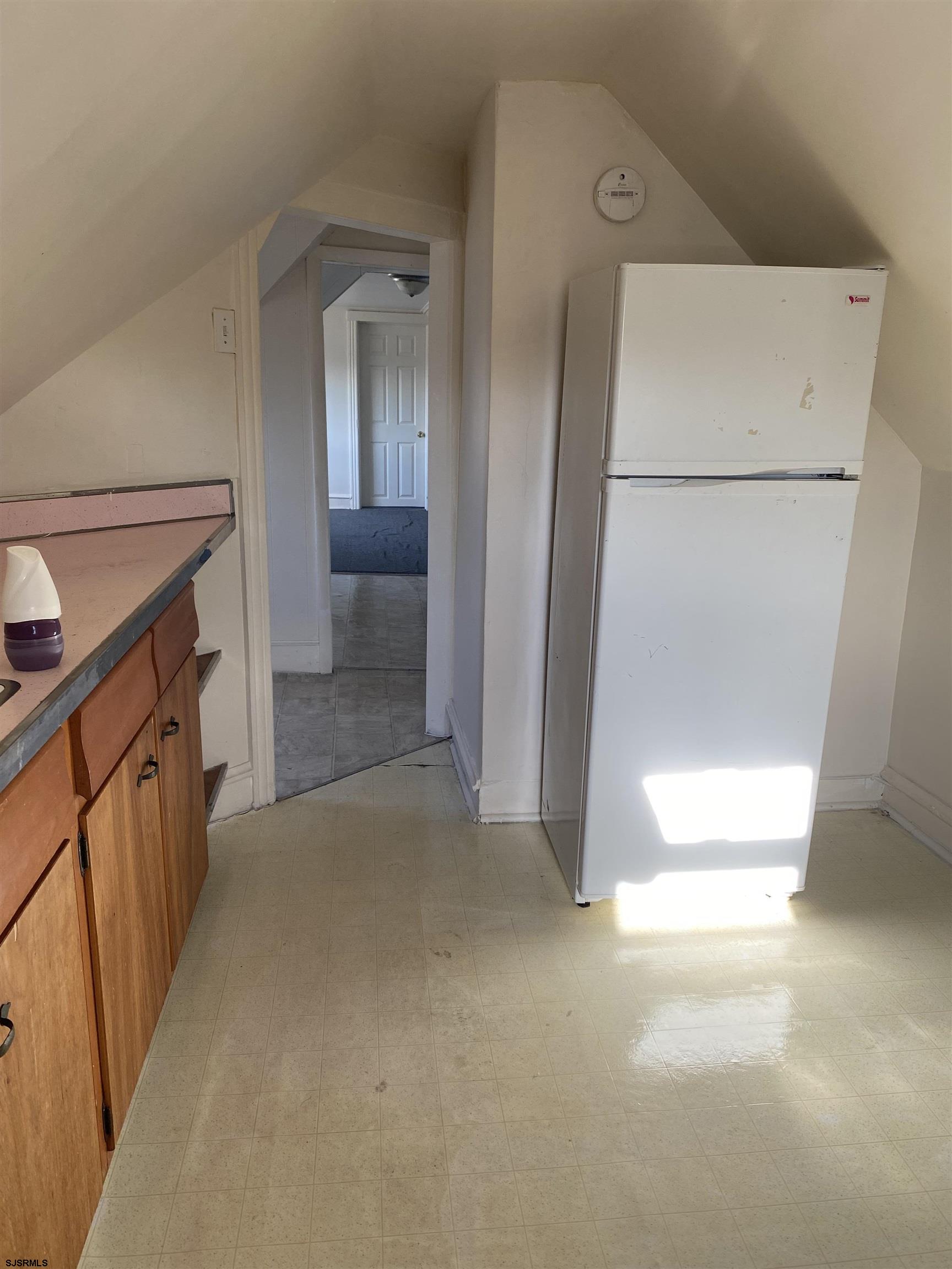 137 West Edgewater Avenue Pleasantville, NJ 08232 - Photo 34 of 36 a view of a kitchen from a hallway