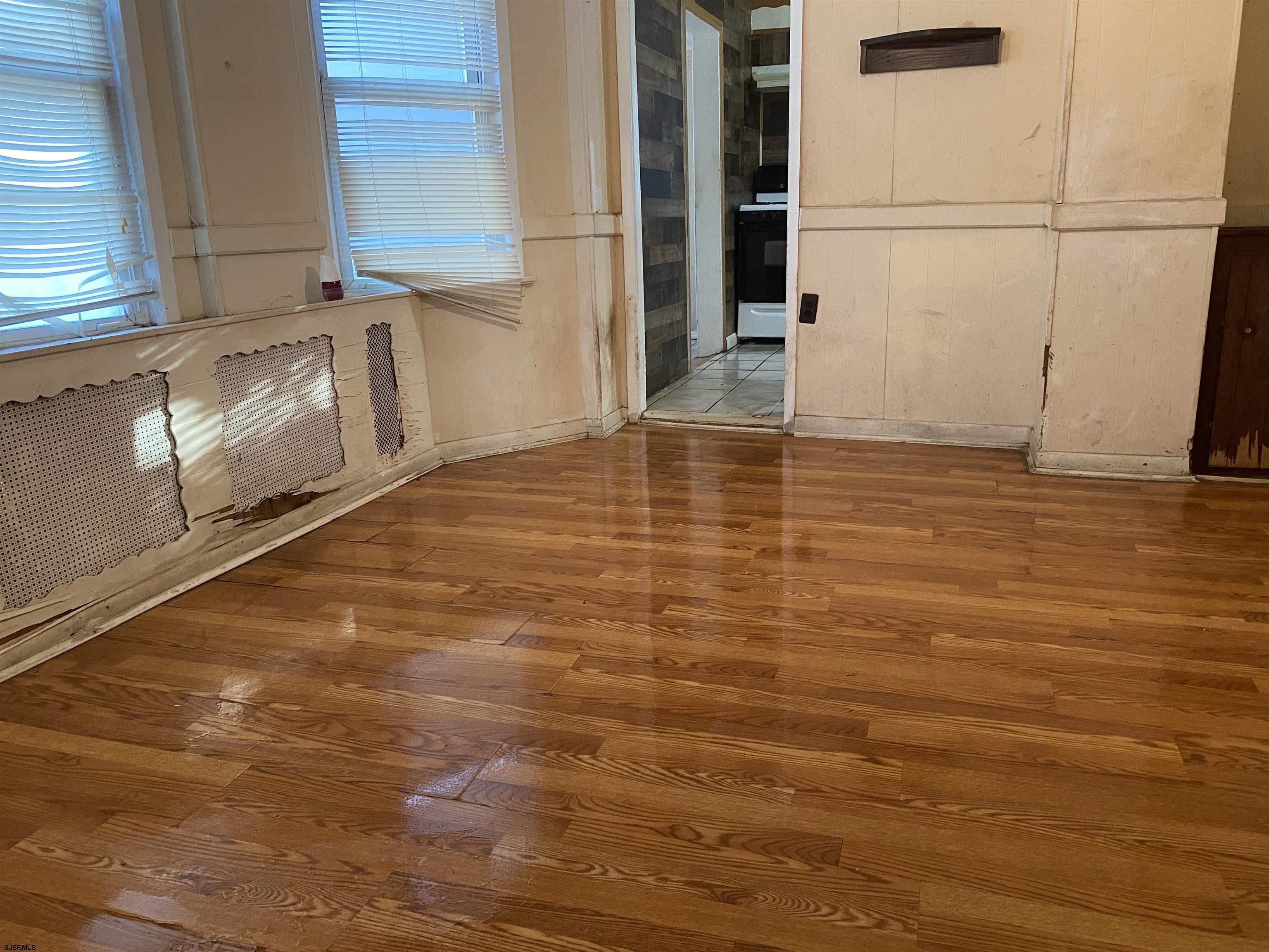137 West Edgewater Avenue Pleasantville, NJ 08232 - Photo 9 of 36 a view of a room with wooden floor and cabinets