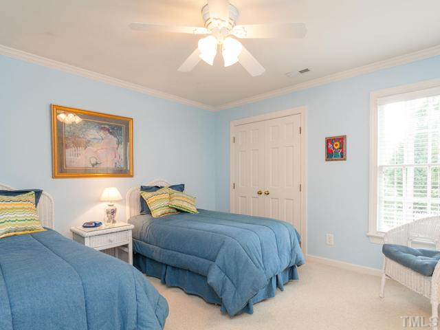 1917 Prescott Place Raleigh, NC 27615 - Photo 17 of 25 This guest bedroom had direct access to a full bath. Additional features include crown molding, ceiling fan, double door closet and plantation blinds. Bedroom