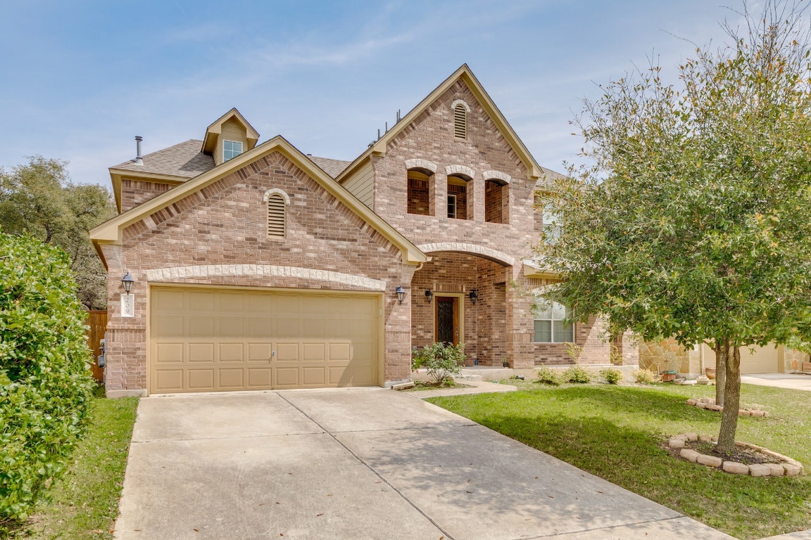 209 Abilene Lane Georgetown, TX 78628 - Photo 1 of 1 a front view of a house with garden