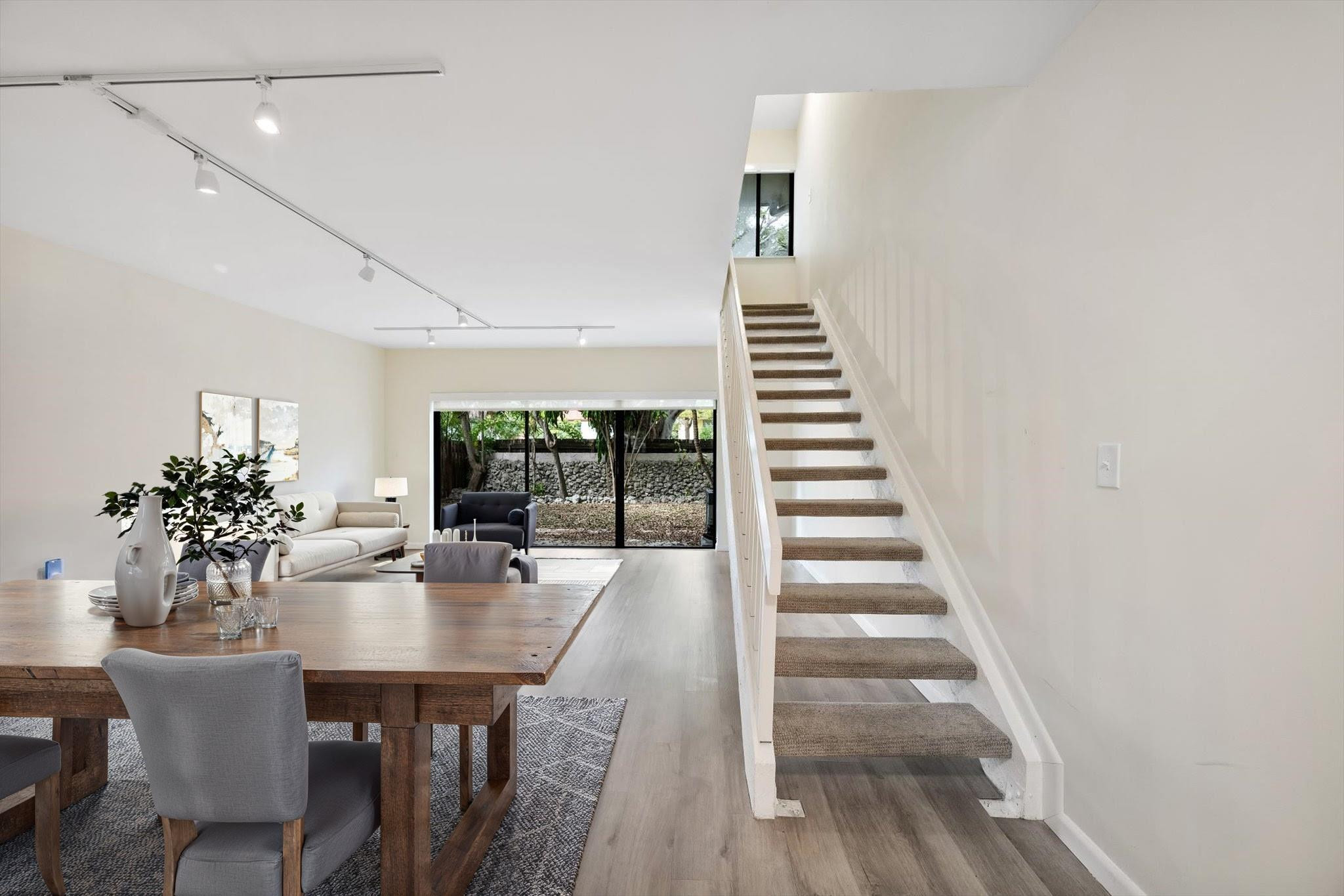 a dining room with furniture and window