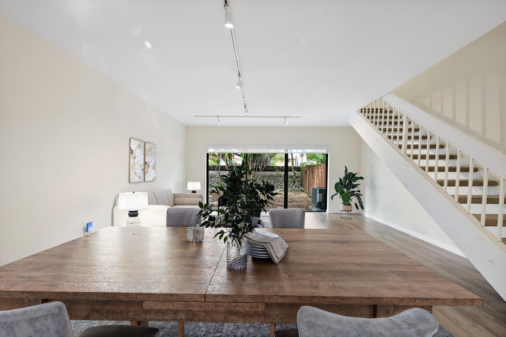 19986 Northeast 5th Court, Unit 4D Miami, FL 33179 - Photo 11 of 46 a view of a living room and dining room