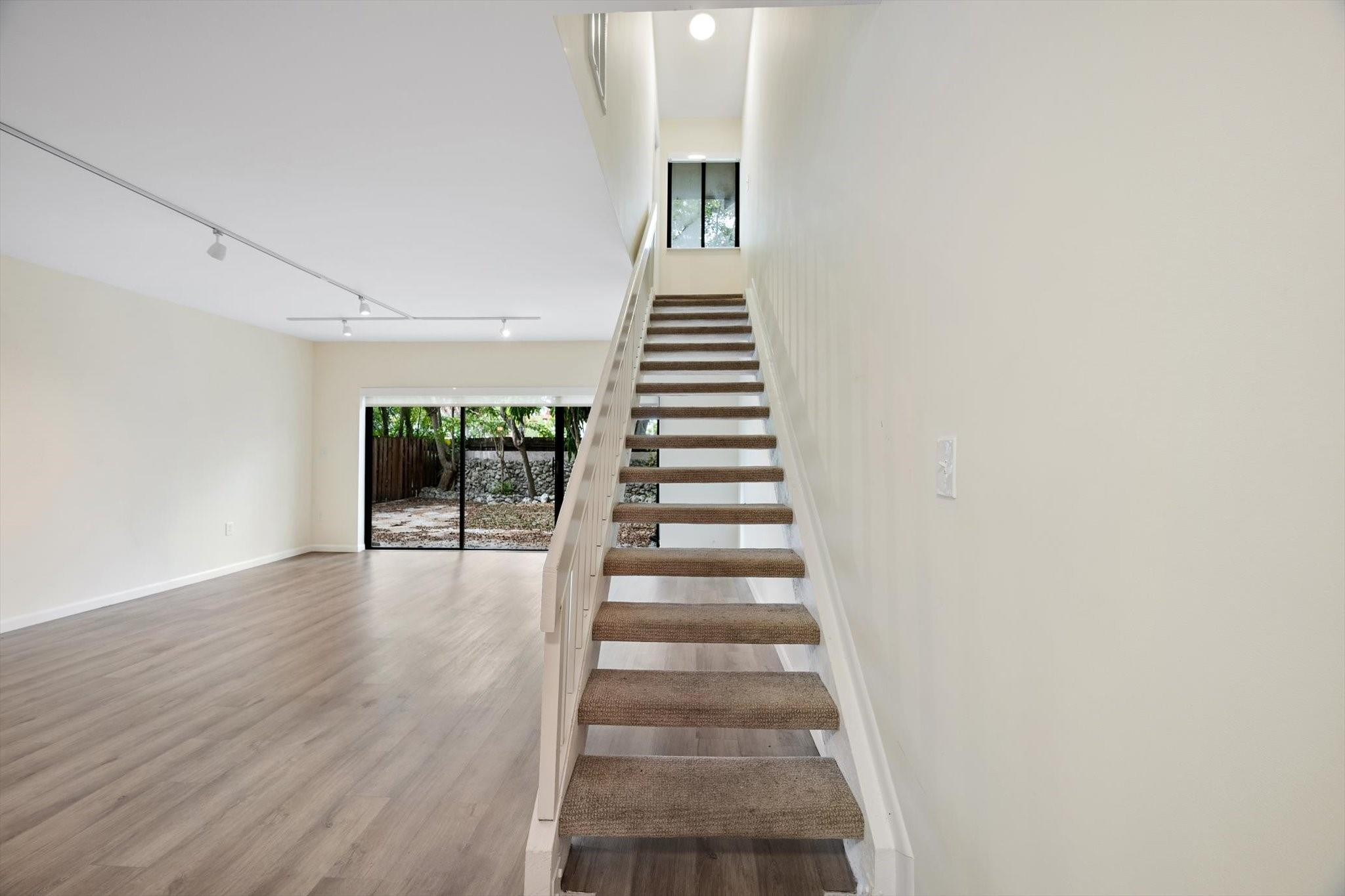 19986 Northeast 5th Court, Unit 4D Miami, FL 33179 - Photo 18 of 46 a view of an entryway with wooden floor
