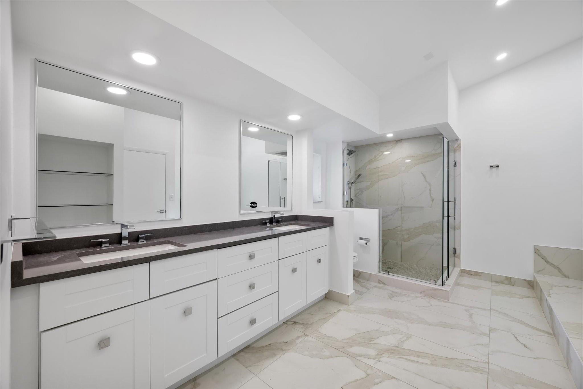 19986 Northeast 5th Court, Unit 4D Miami, FL 33179 - Photo 25 of 46 a bathroom with a double vanity sink and mirror