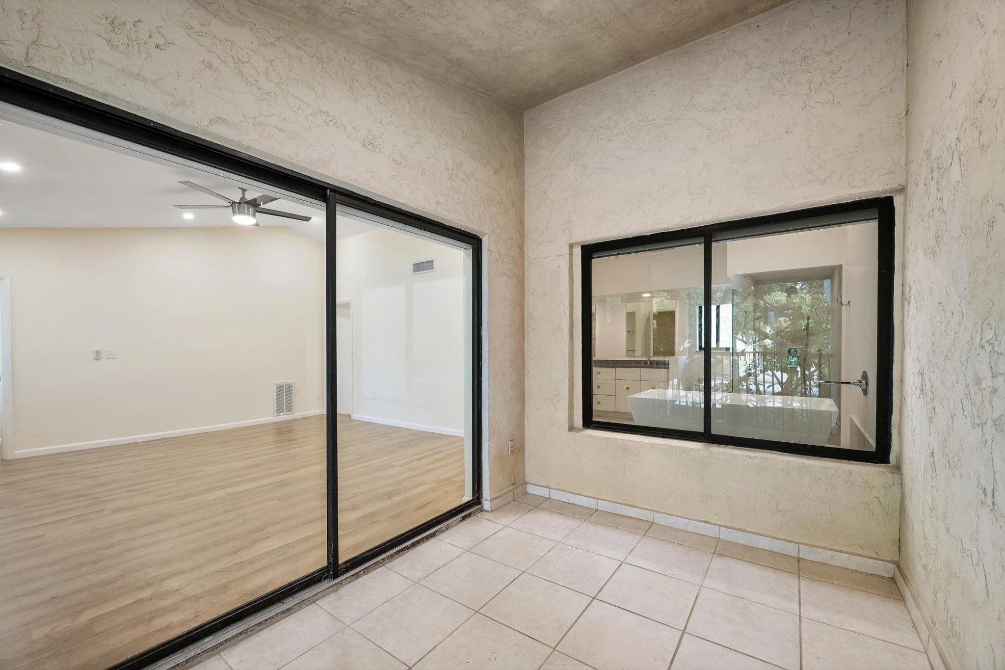 19986 Northeast 5th Court, Unit 4D Miami, FL 33179 - Photo 30 of 46 a view of empty room with window