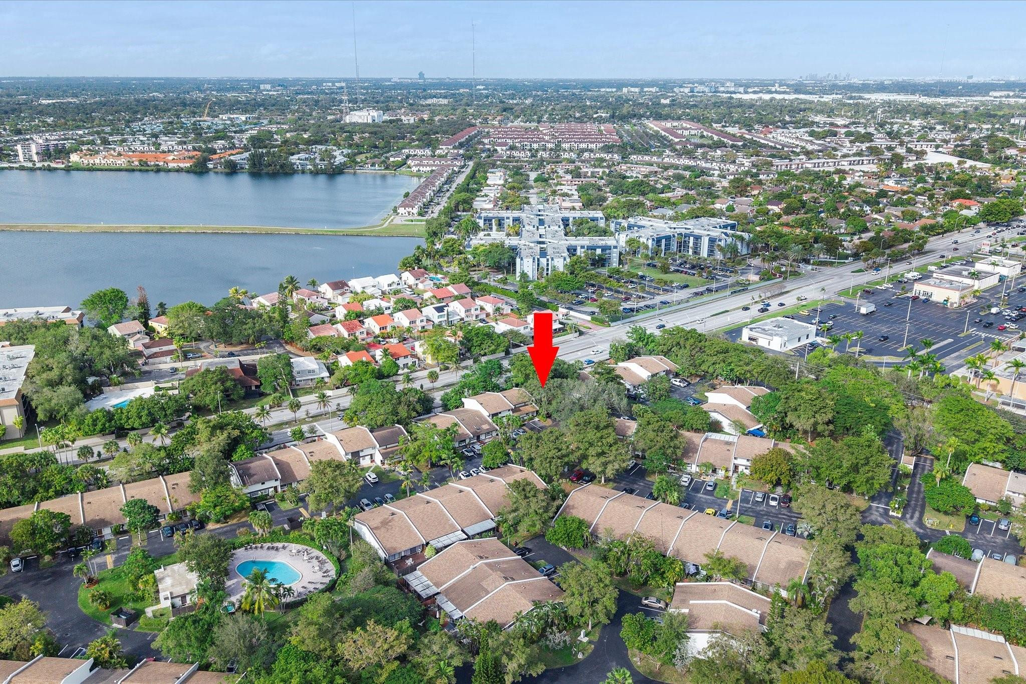 19986 Northeast 5th Court, Unit 4D Miami, FL 33179 - Photo 41 of 46 an aerial view of lake and residential houses with outdoor space