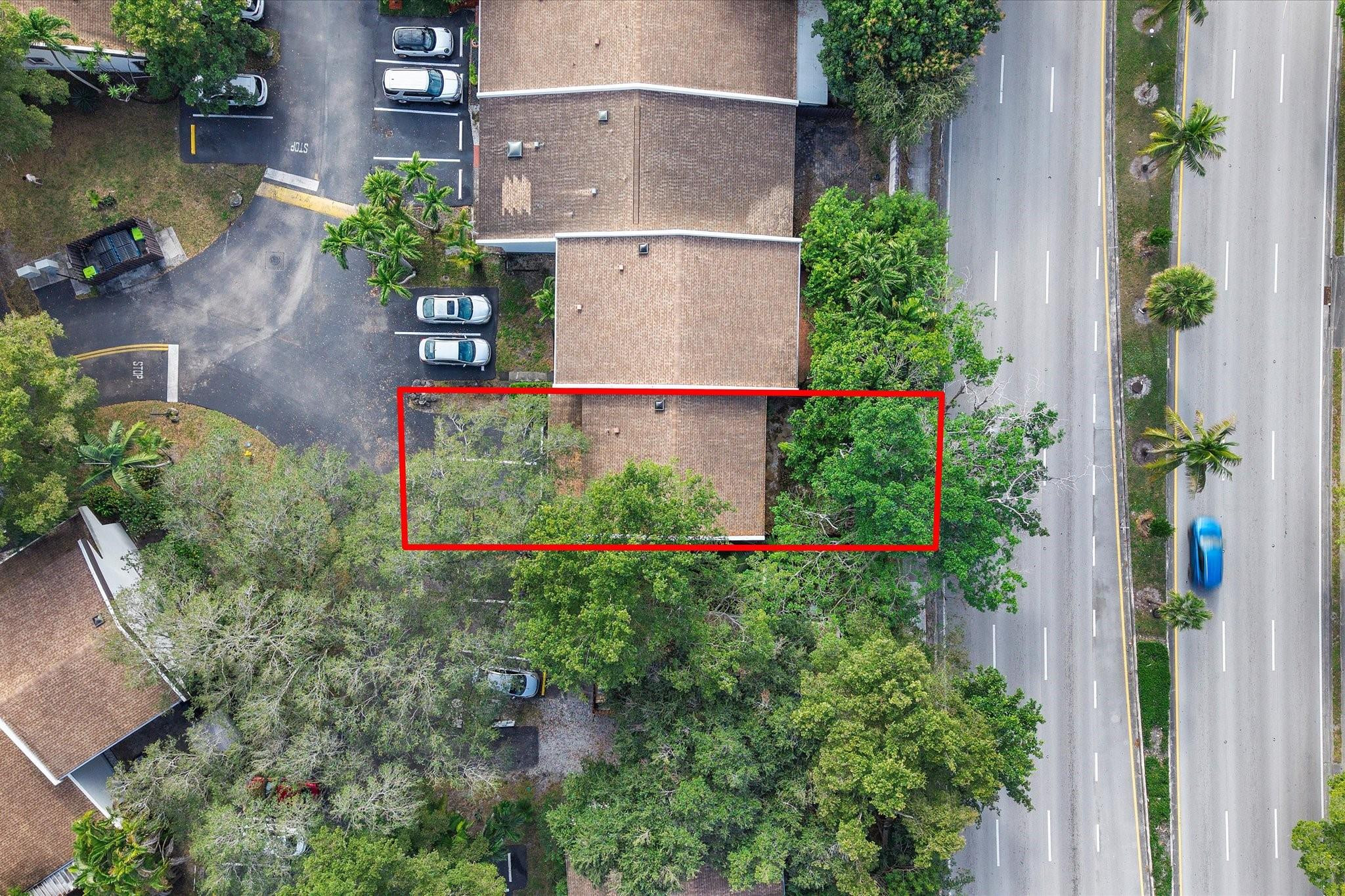 19986 Northeast 5th Court, Unit 4D Miami, FL 33179 - Photo 43 of 46 an aerial view of a house with a yard and garden