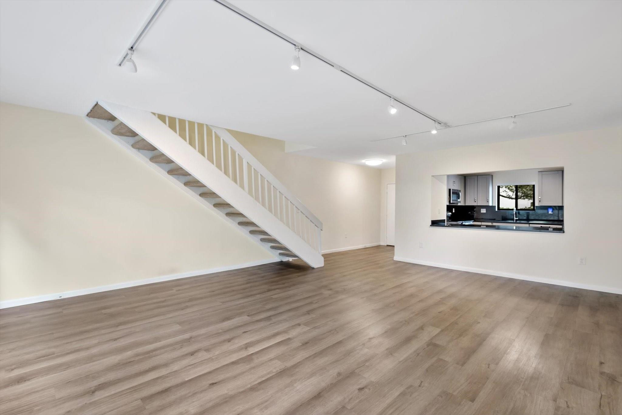 19986 Northeast 5th Court, Unit 4D Miami, FL 33179 - Photo 10 of 46 a view of empty room with wooden floor