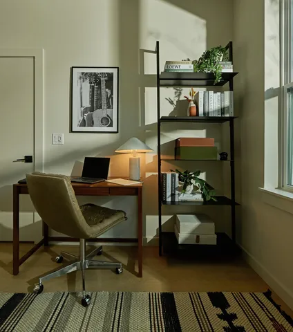 a work room with furniture and wooden floor