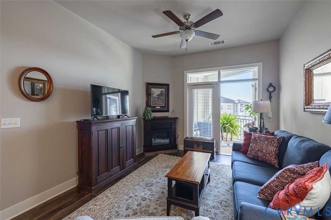 10521 Stony Bluff Drive, Unit 402 Ashland, VA 23005 - Photo 14 of 45 Living room featuring a glass covered fireplace, d