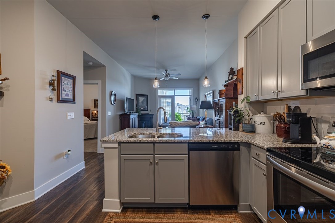 10521 Stony Bluff Drive, Unit 402 Ashland, VA 23005 - Photo 3 of 45 Kitchen with gray cabinetry, appliances with stain