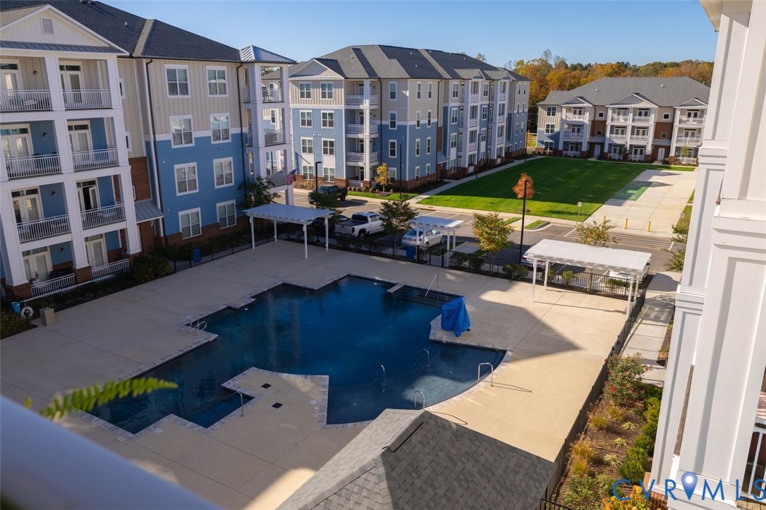 10521 Stony Bluff Drive, Unit 402 Ashland, VA 23005 - Photo 43 of 45 Community pool with a patio
