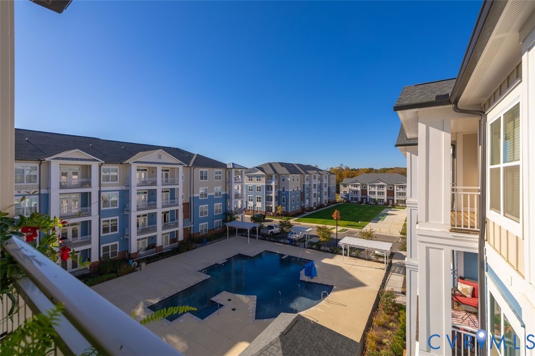 10521 Stony Bluff Drive, Unit 402 Ashland, VA 23005 - Photo 44 of 45 Community pool featuring a balcony