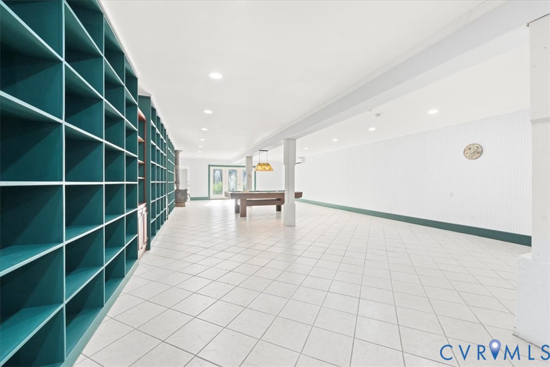 1208 Manteo Road Buckingham, VA 23921 - Photo 16 of 44 a view of an empty room with stairs and a workspace