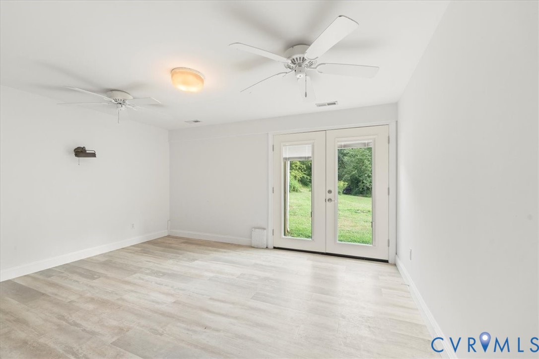 1208 Manteo Road Buckingham, VA 23921 - Photo 21 of 44 a view of an empty room with a window