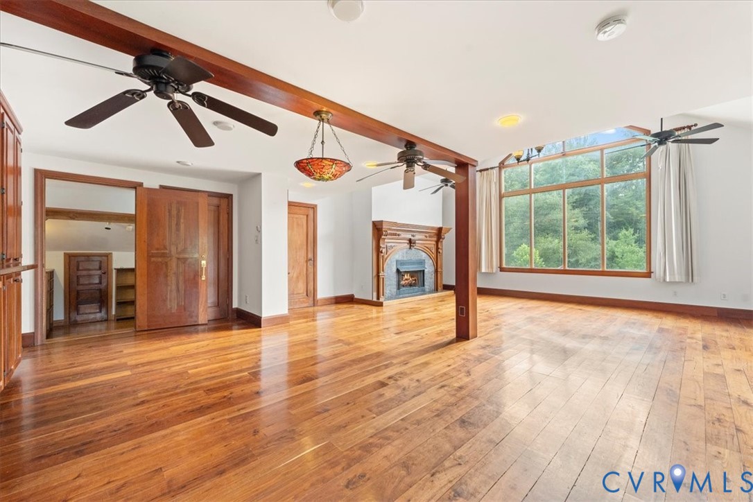 1208 Manteo Road Buckingham, VA 23921 - Photo 28 of 44 a view of an empty room with wooden floor and a window