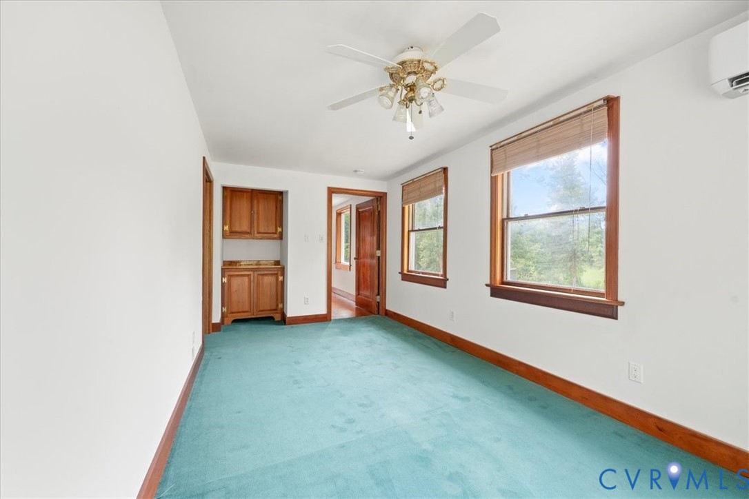 1208 Manteo Road Buckingham, VA 23921 - Photo 34 of 44 an empty room with windows