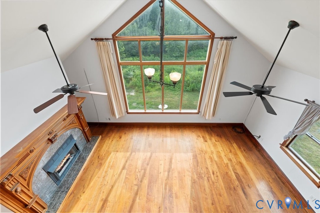 1208 Manteo Road Buckingham, VA 23921 - Photo 7 of 44 a view of a room with wooden floor and windows