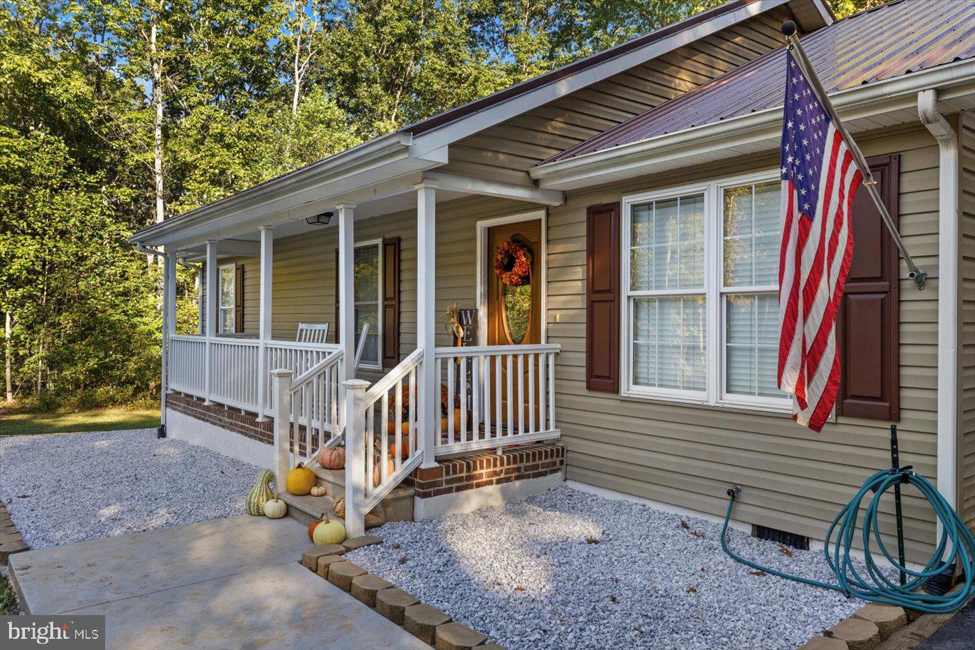 25281 Boling Lane Rhoadesville, VA 22542 - Photo 2 of 41 a view of a house with a yard and deck