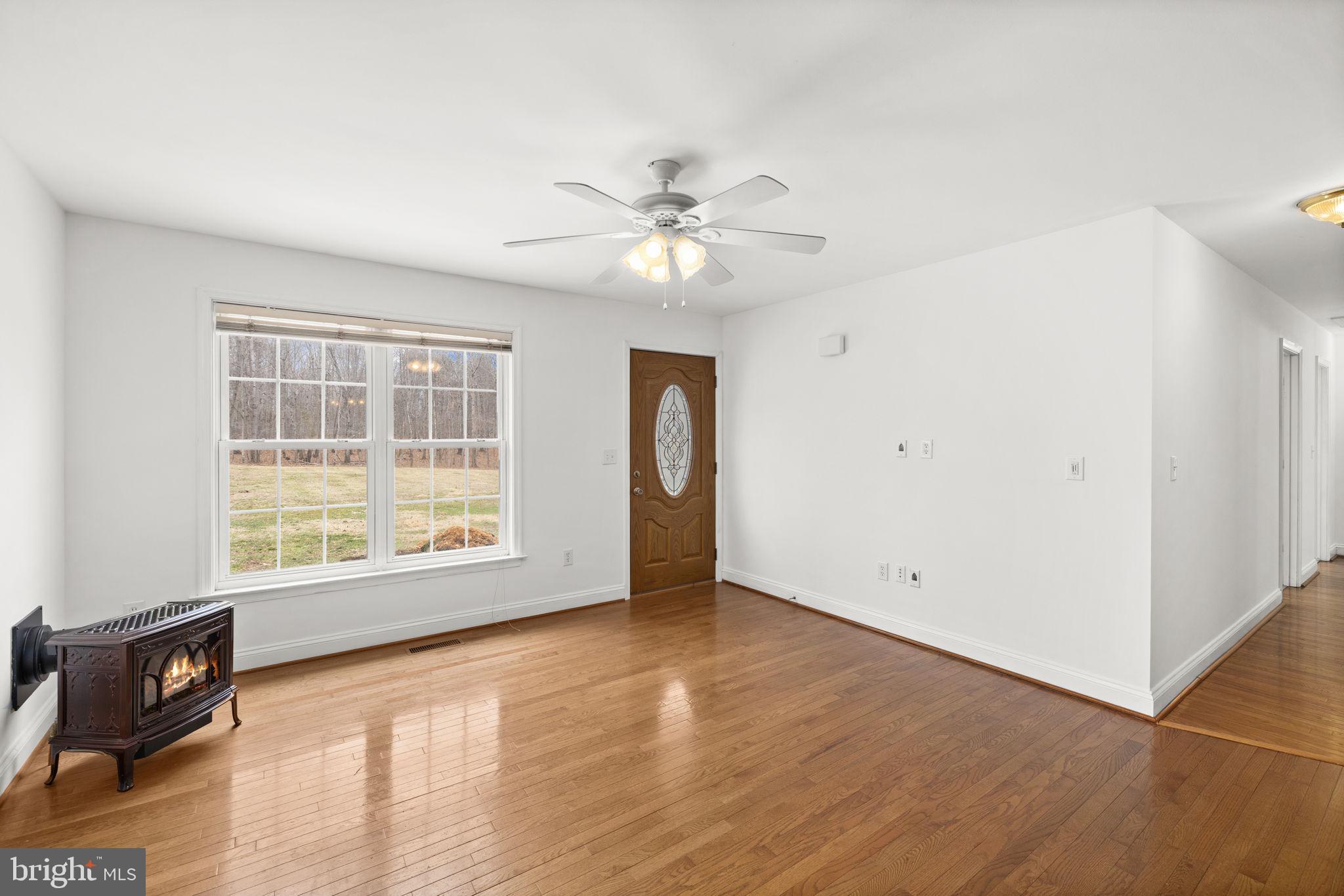 25281 Boling Lane Rhoadesville, VA 22542 - Photo 22 of 41 a view of an empty room with window and wooden floor