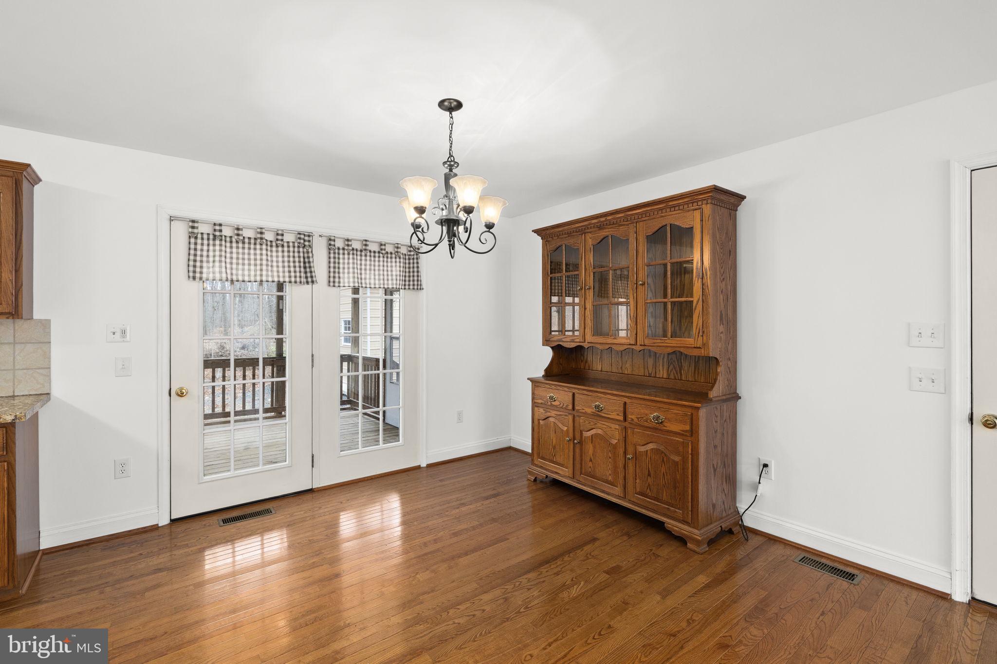 25281 Boling Lane Rhoadesville, VA 22542 - Photo 26 of 41 a view of an empty room with wooden floor and a window