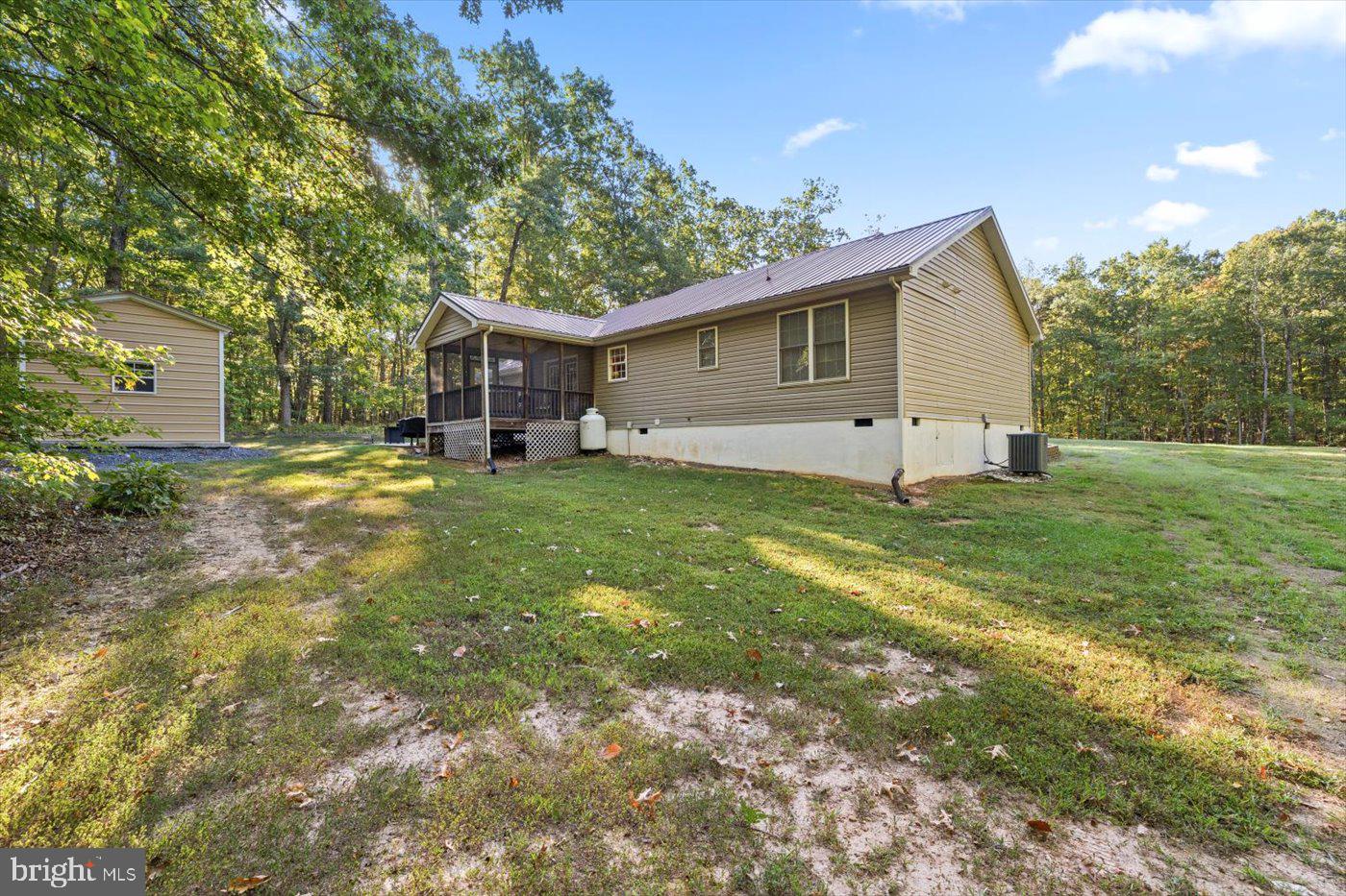 25281 Boling Lane Rhoadesville, VA 22542 - Photo 32 of 41 a big house with a big yard and large trees
