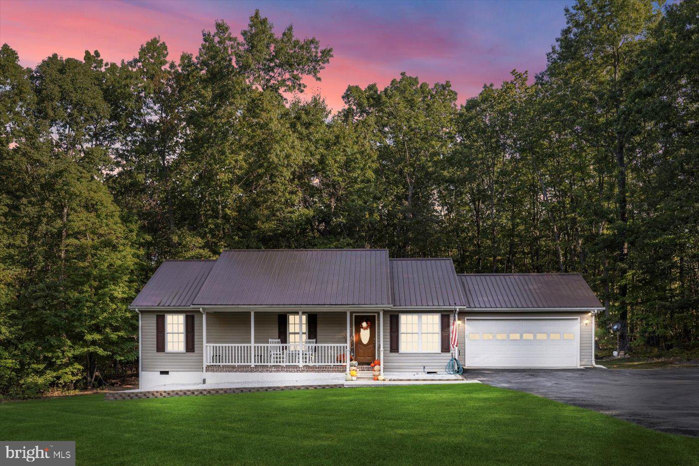25281 Boling Lane Rhoadesville, VA 22542 - Photo 35 of 41 a front view of a house with a garden and trees