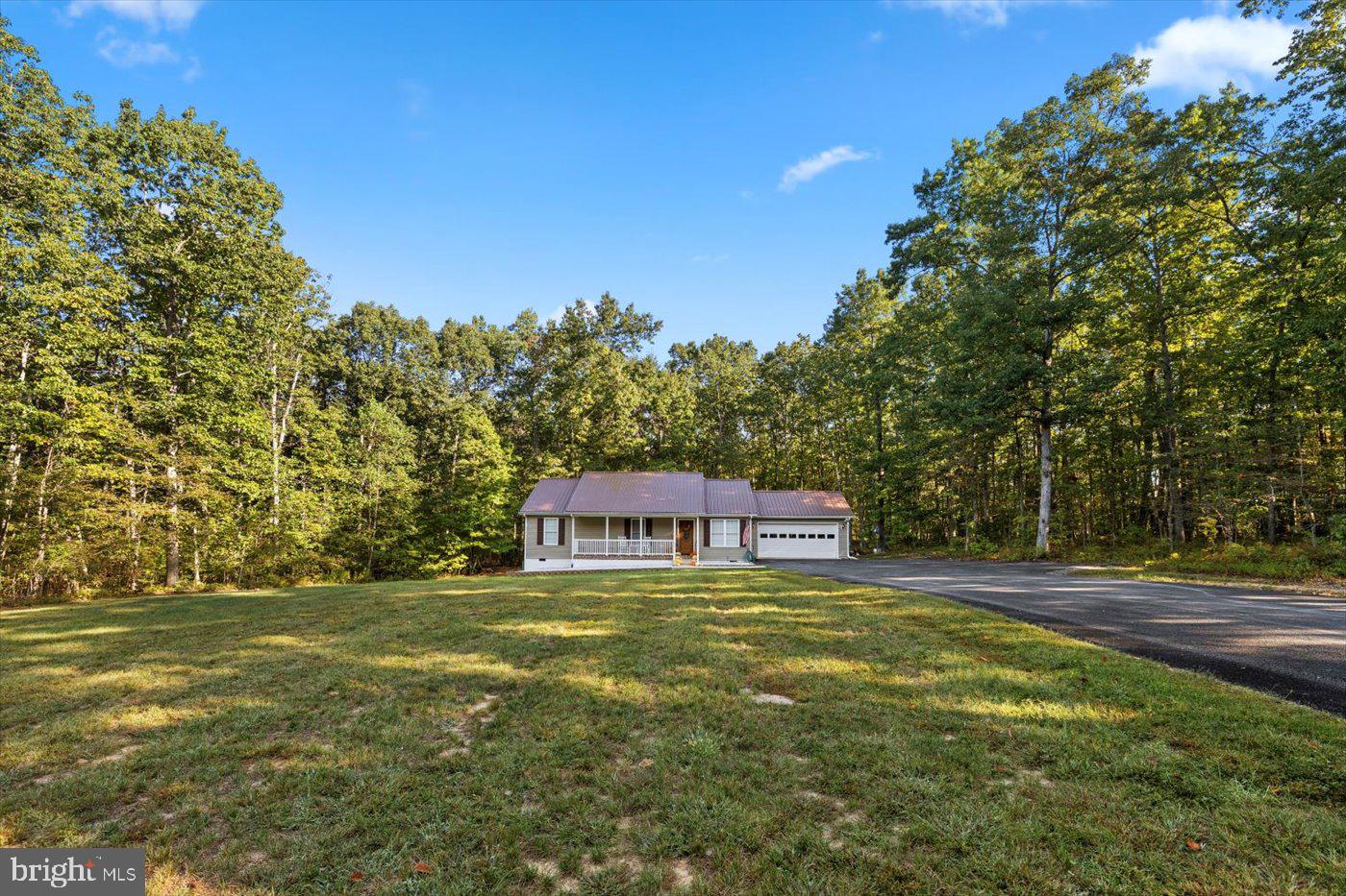 25281 Boling Lane Rhoadesville, VA 22542 - Photo 36 of 41 a view of an house with backyard and trees