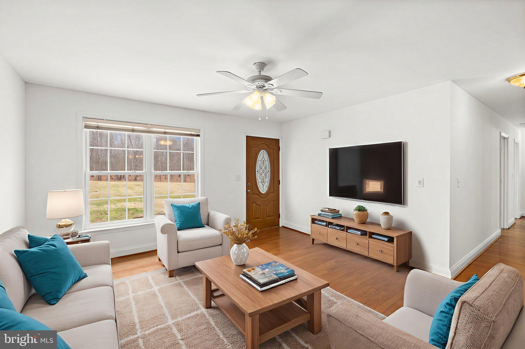 25281 Boling Lane Rhoadesville, VA 22542 - Photo 4 of 41 a living room with furniture a flat screen tv and a window