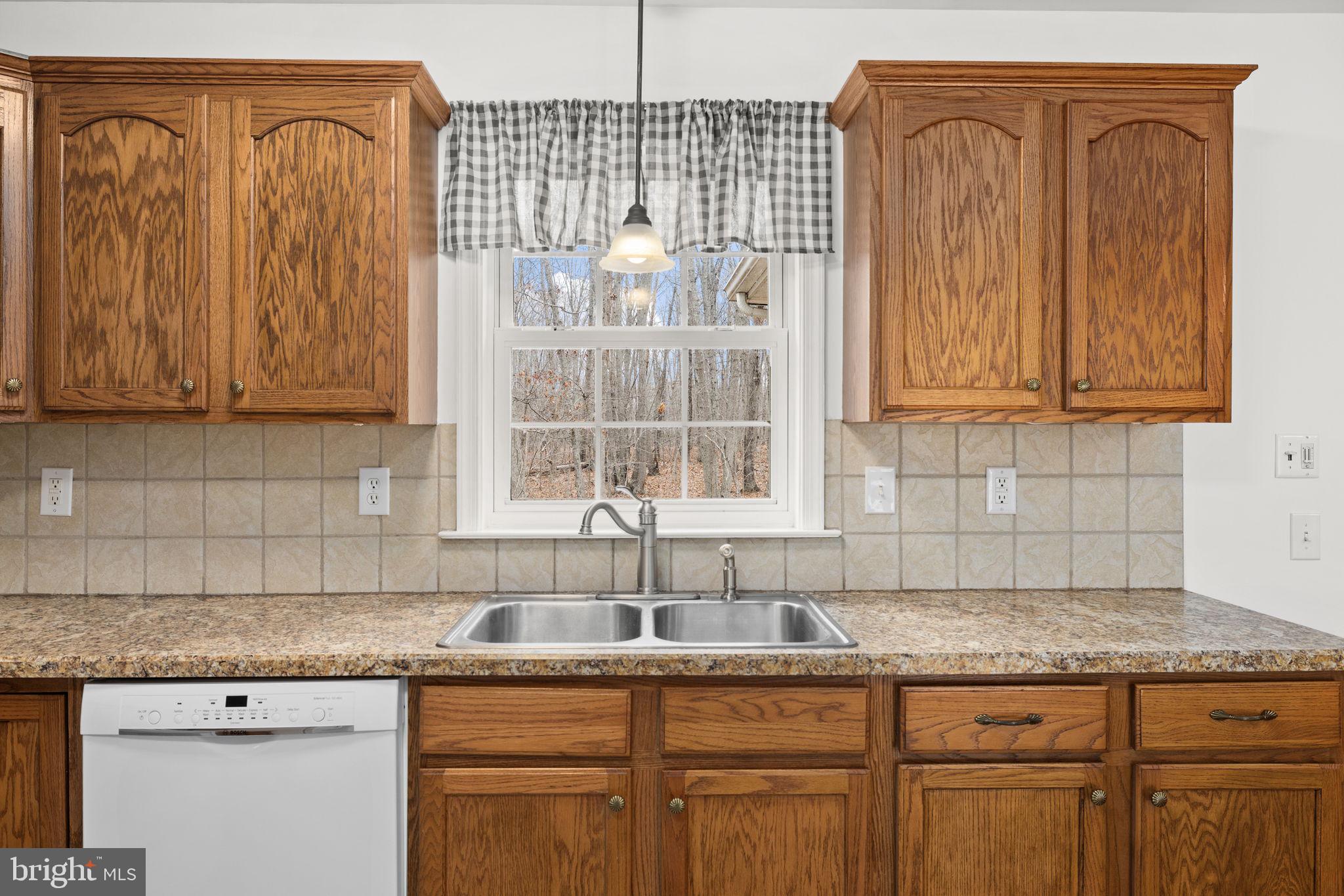25281 Boling Lane Rhoadesville, VA 22542 - Photo 8 of 41 a kitchen with cabinets appliances and a sink
