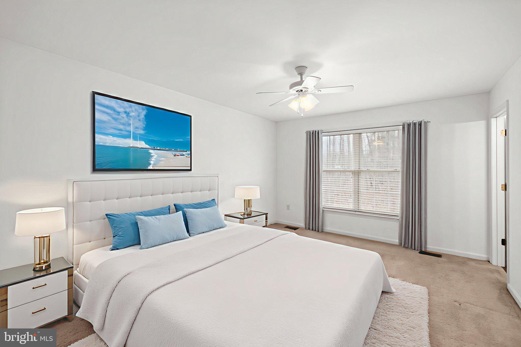 25281 Boling Lane Rhoadesville, VA 22542 - Photo 9 of 41 a bedroom with a large bed and a window