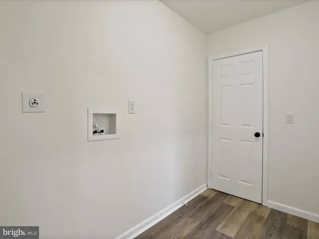 a view of a small space with wooden floor