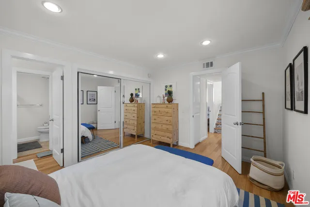 a bedroom with a bed and a view of bathroom